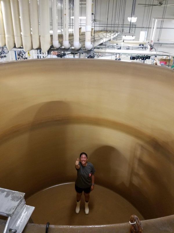 Nguyen saying "Gig 'em" from the bottom of a tank at the Horn Point Laboratory in Cambridge, Maryland